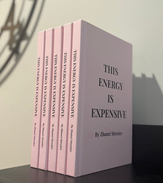 Set of books titled 'This Energy is Expensive' by Zhanei Strozier on a plain background